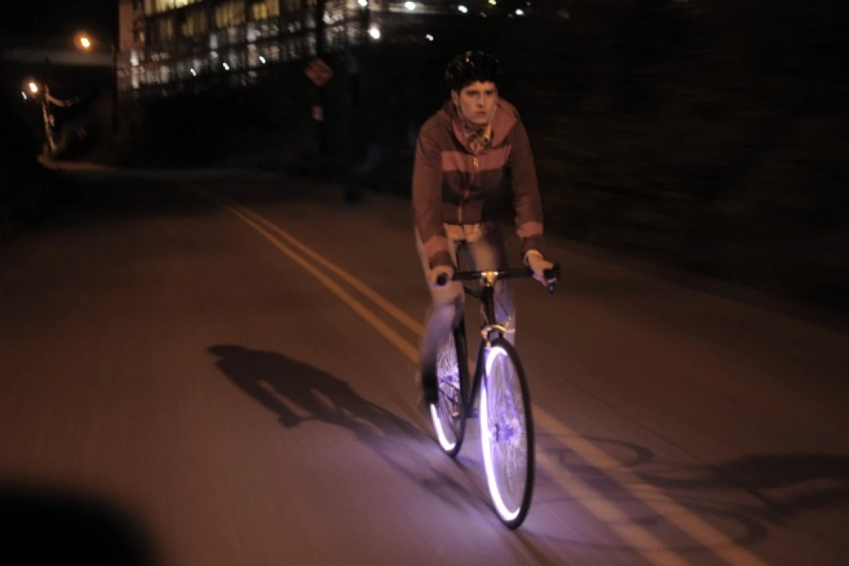 Two groups of entrepreneurs are currently developing separate products (one of which is the Aura system, above), both of which are intended to let bicycle wheels serve as running lights