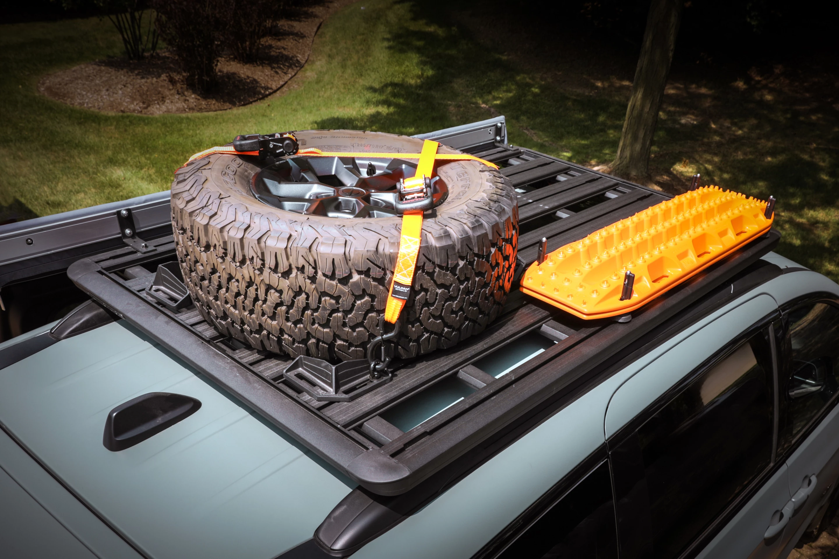 The versatile Rhino-Rack Pioneer Platform roof rack provides easy storage option for key gear like traction aids and spare tires