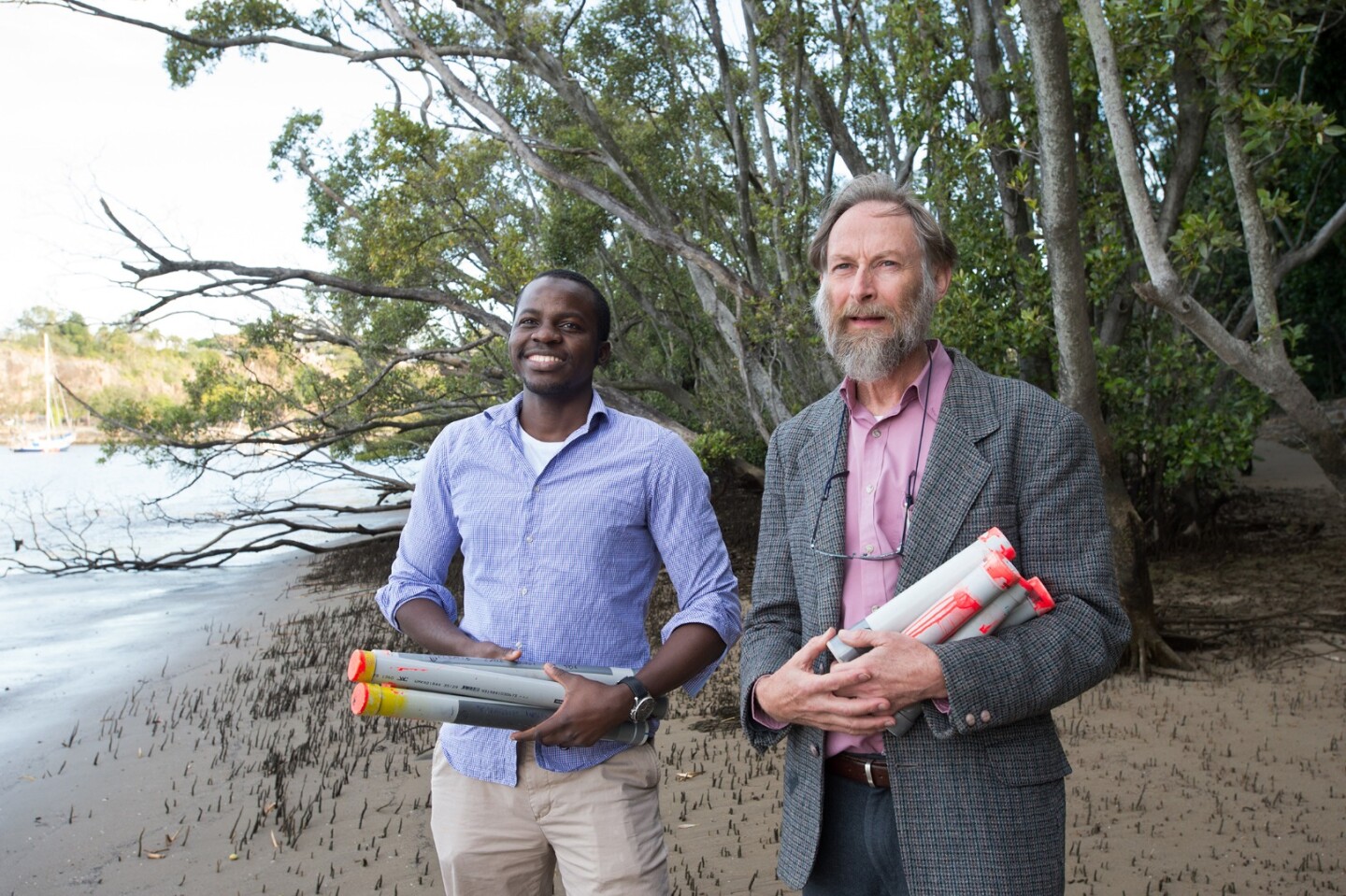QUT researchers Dr Kabir Suara and Professor Richard Brown with their Drifter devices