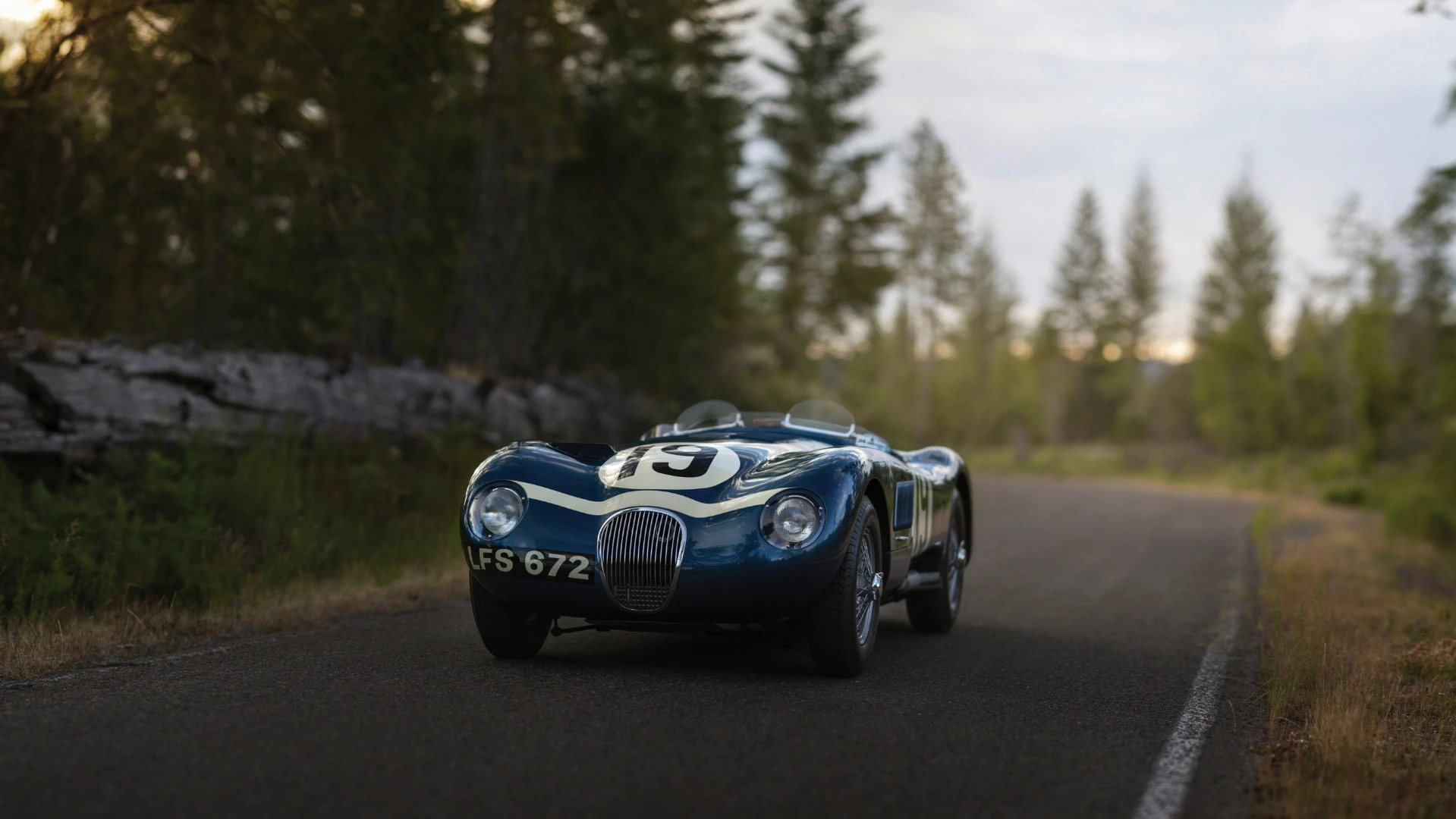 There were just 53 C-Type Jaguars built. Three lightweight works cars (of which this car is one), and a run of 50 cars to satisfy customer demand after the factory cars finished first, second and fourth in the 1953 Le Mans 24 Hour event. The biggest difference to the competition were the disc brakes. Endurance racing was born to demonstrate reliability and validate new automotive technologies for the masses and just as it has done more recently with hybrid and diesel drivetrains, Le Mans heralded the coming of age of a new braking technology with this car and its works siblings. The winning C-type was the first to average more than 100 mph for the 24 Hours of Le Mans (105.8 mph, 170 km/h), and this car, which finished fourth, also broke the ton, averaging 104 mph (167 km/h). Equally at home in any of the world’s finest concours or vintage rallies, this car represents a landmark in Jaguar history.