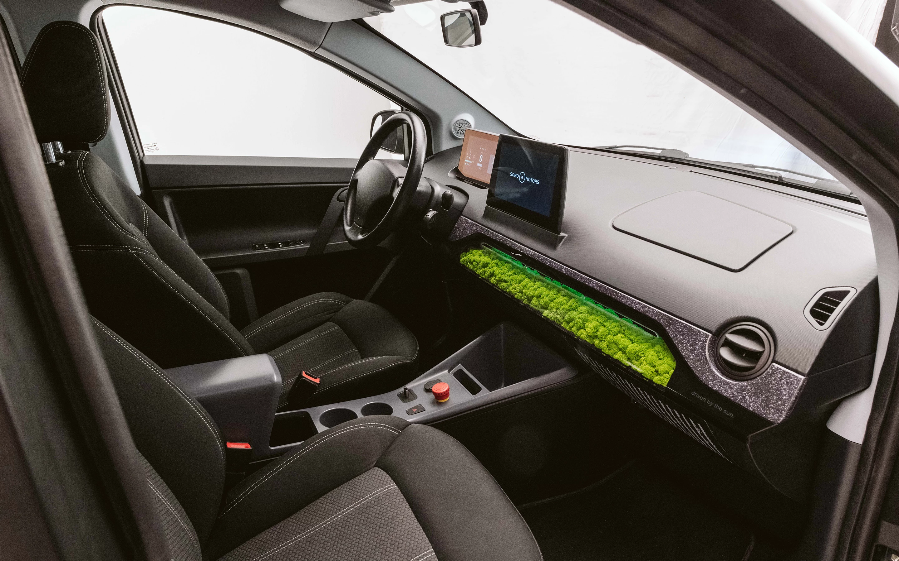 A natural air filtration system using island moss is the main attraction inside the Sion solar electric vehicle