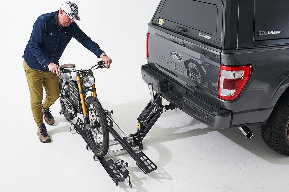 Users can roll eMTBs or electric motorbikes on and off of the Bike Lifter tray