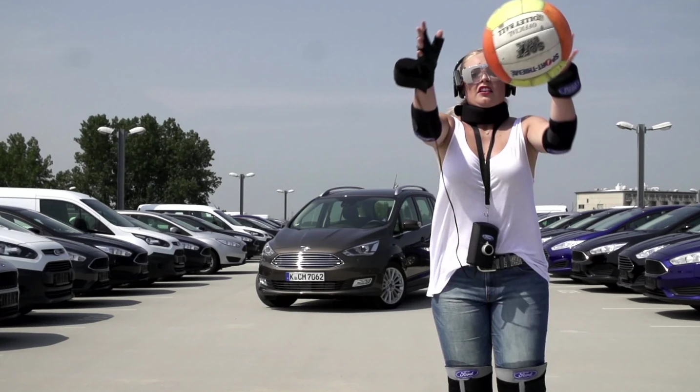 The suit uses strategically-placed weights and heavy padding reduce mobility in the arms and legs, while goggles and headphones reduce awareness