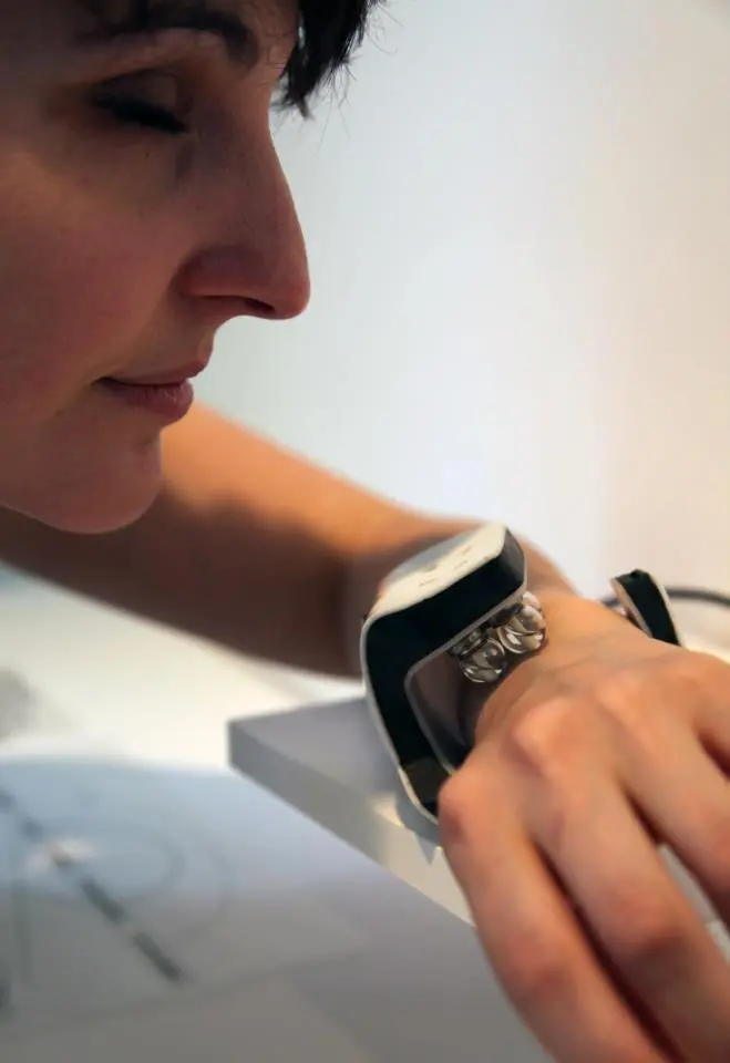 A user inhales the whiff of scent emitted by the scent watch (Photo: Aisen Caro Chacin)