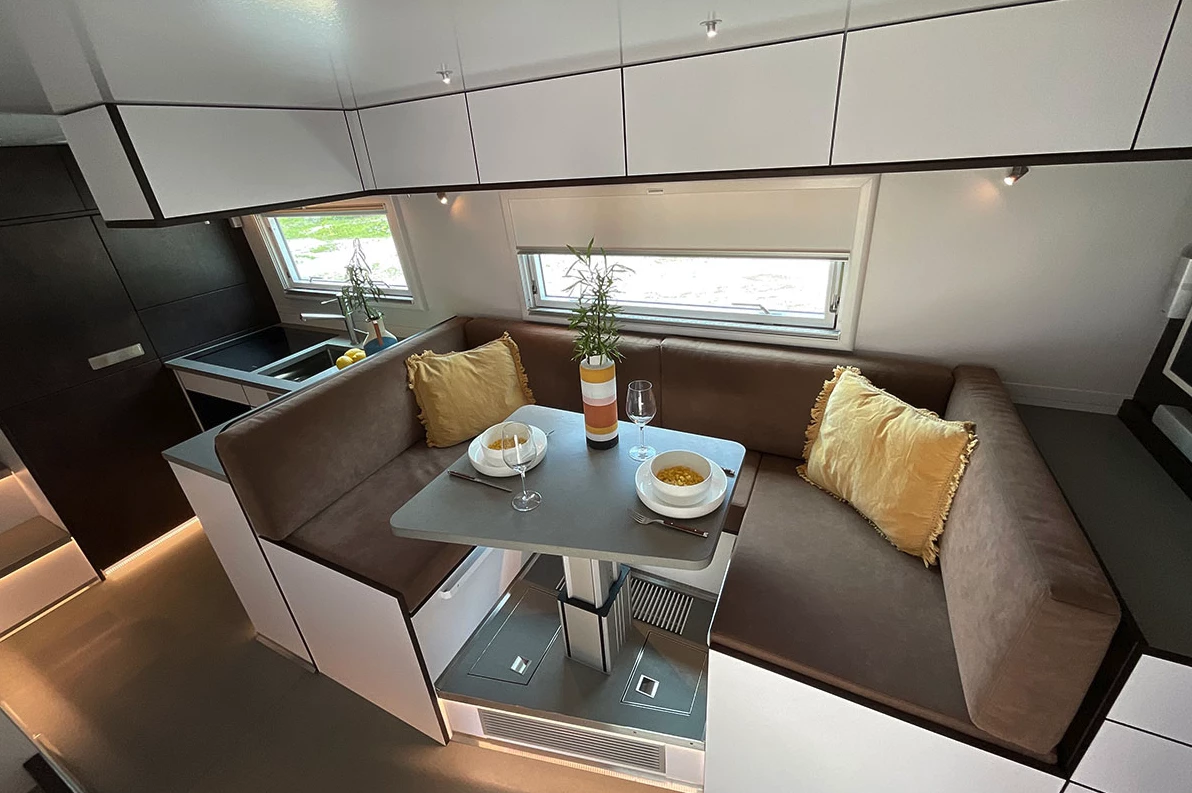 The large front dining area becomes a sofa/bed