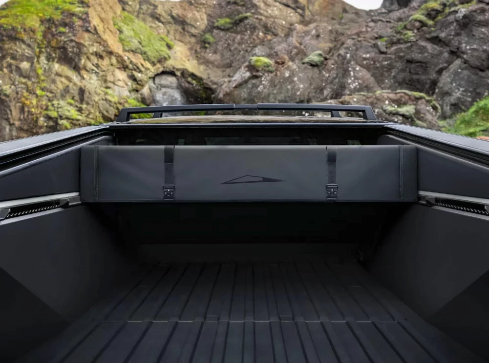 The Basecamper includes brackets to mount on the Cybertruck L-track, well up over the bed floor but below the retractable bed cover