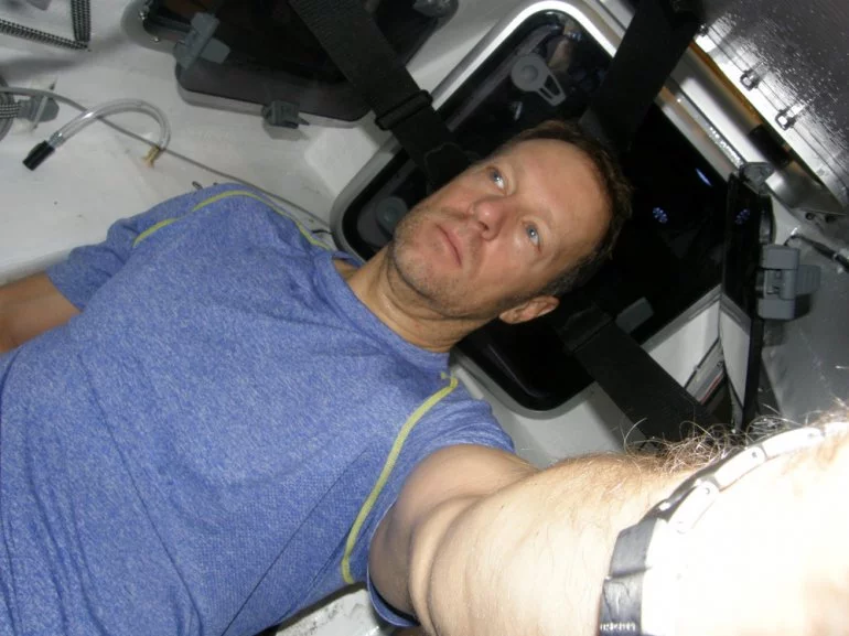 Greg Kolodziejzyk inside his pedal-powered boat, WiTHiN