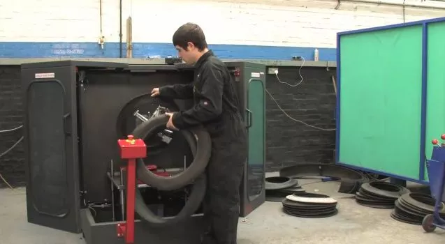 The SymTyre-S300 is a machine that cuts up discarded tires, so they can be flat-packed for more efficient storage and transport