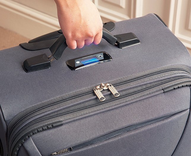 Self-weighing suitcase
