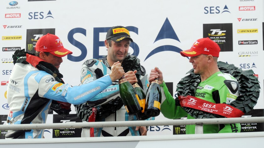 Rutter, Miller and George Spence share the podium at the 2011 IOM TT Zero