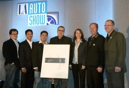 The GM design team includes (l to r) Steve Anderson, Jay Bernard, Senon Franco III, and Frank Saucedo. Also pictured are award presenters Chuck Pelley and Stuart Reed.