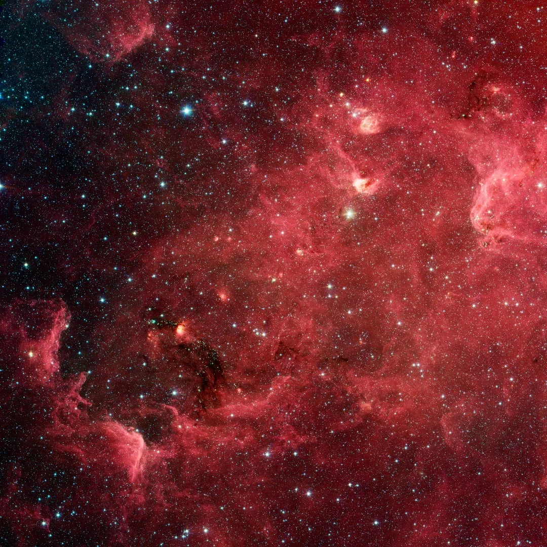 This infrared image from Spitzer shows what’s known as the North America Nebula, although the shape of the cloud that gives it its name vanishes in infrared light.