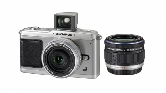 Olympus E-P1 shown with 17mm f/2.8 lens and VF-1 viewfinder installed