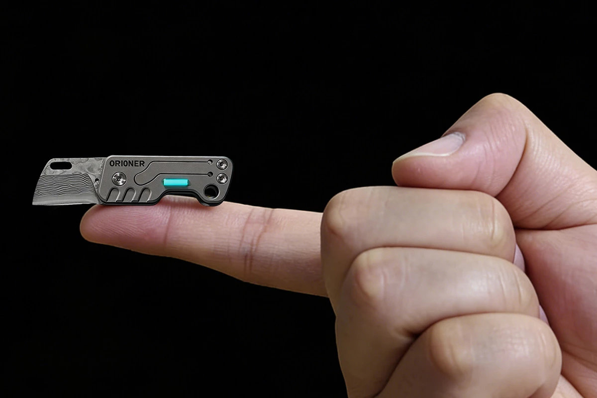 This folding knife features the smallest Damascus steel blade I've ever seen