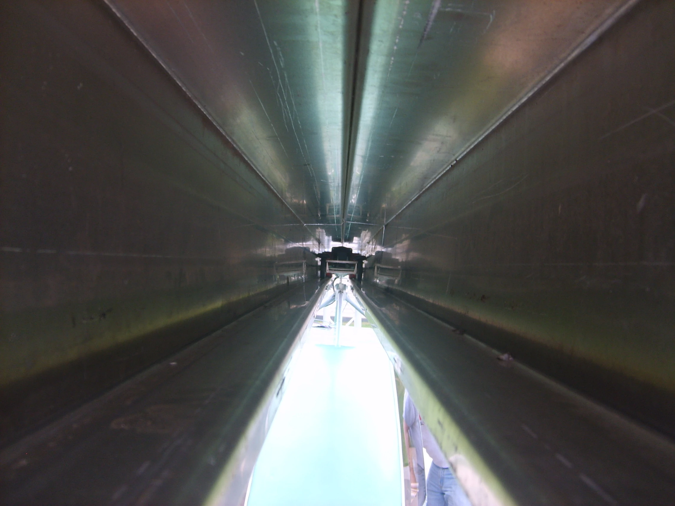 The computer-chauffeured pods pick up power from a third rail using brushes