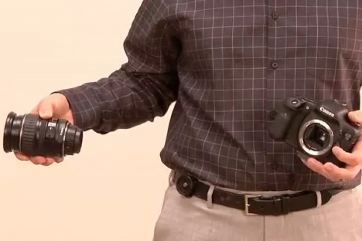 The Backer Capper (seen here mounted on a belt) is a product that's designed to make it easier for photographers to change lenses when they can't put their camera down