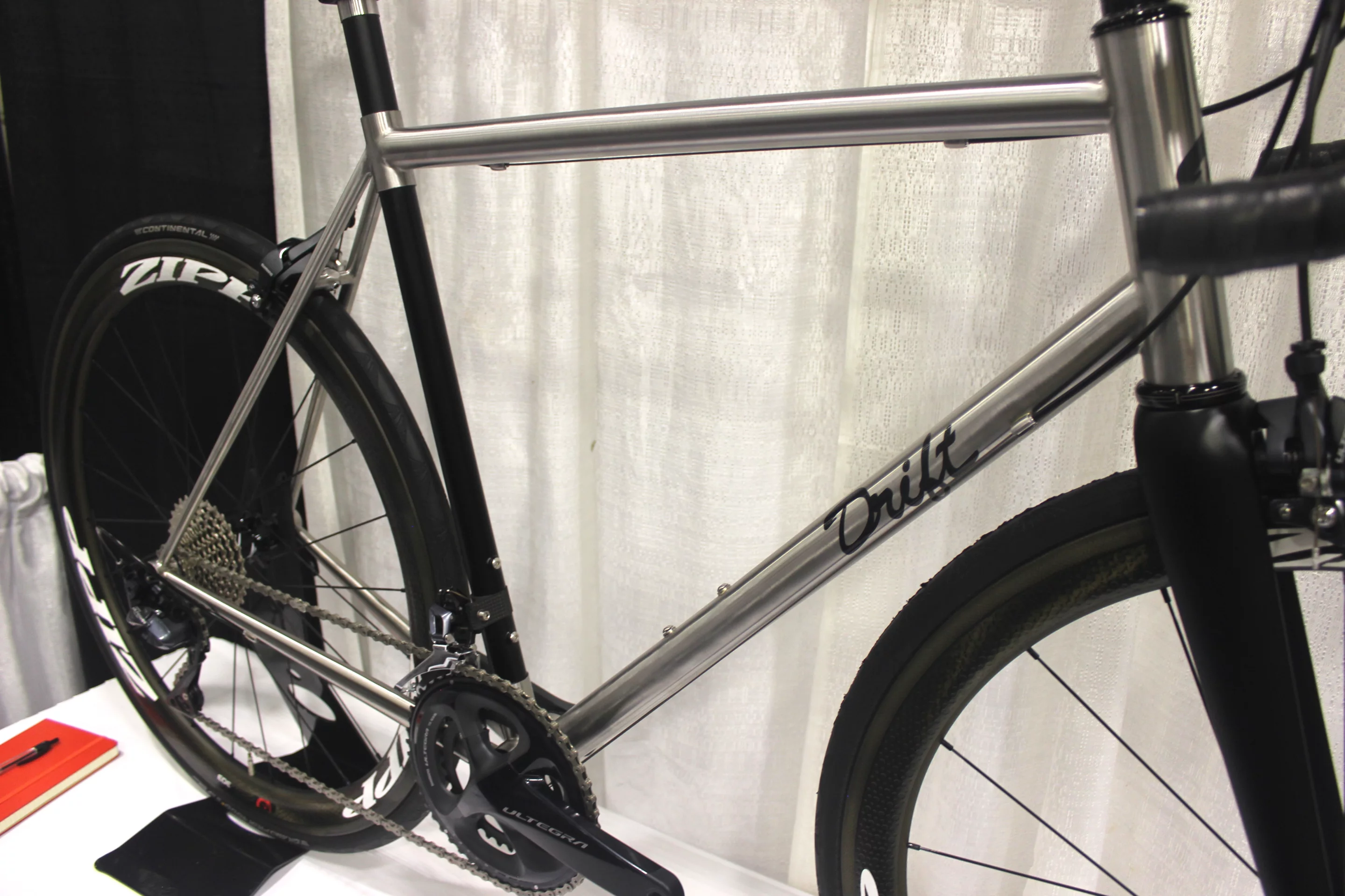 A road bike from Drift, which combines a stainless steel main frame with a carbon fiber seat tube