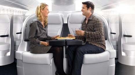 The Air New Zealand Space Seat allows couples to enjoy a shared table (Credit: Air New Zealand)