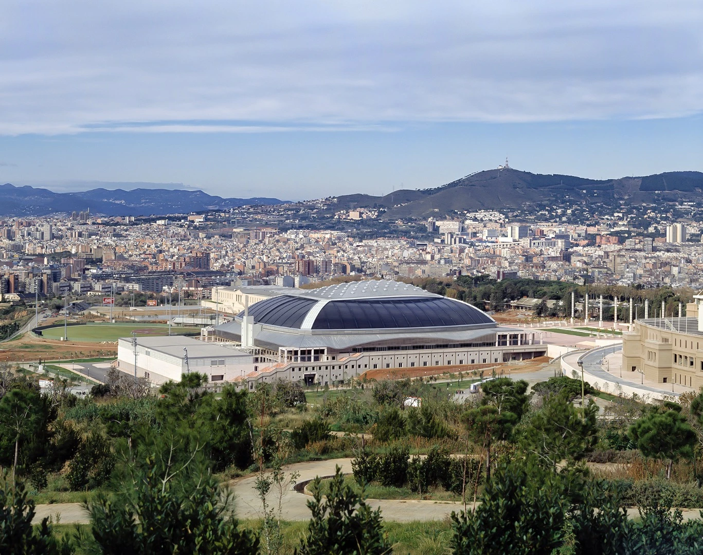 Palau Sant Jordi is defined by its massive domed roof and signature convex windows