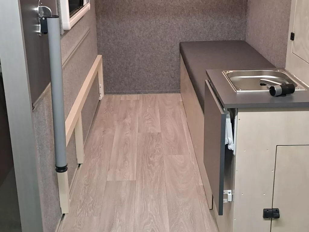 The Maxx-Flexx bed folds and slides to the side to clear room for larger cargo like bicycles