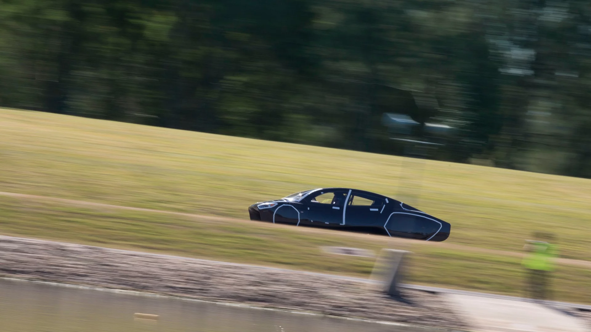 The Sunswift Violet electric sedan undergoing pre-race testing at the Sydney Motorsport speedway track in Eastern Creek, New South Wales, Australia