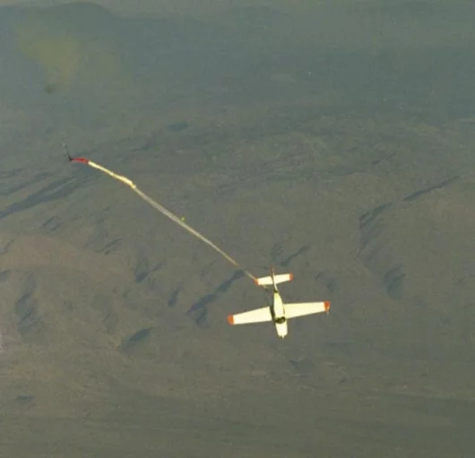 First of a sequence of three pics - the aircraft deploys the chute