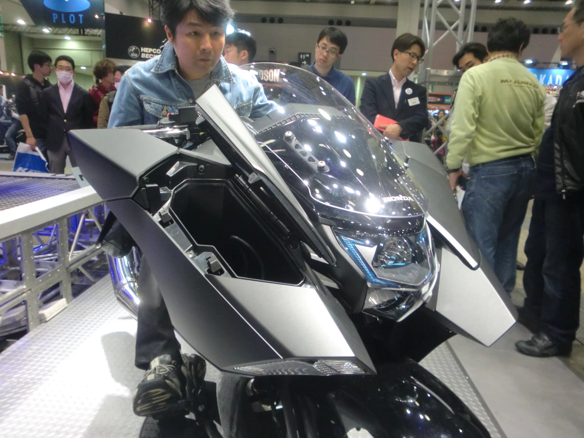 The front of the Honda NM4-01 features some clever storage holes either side of the front screen
