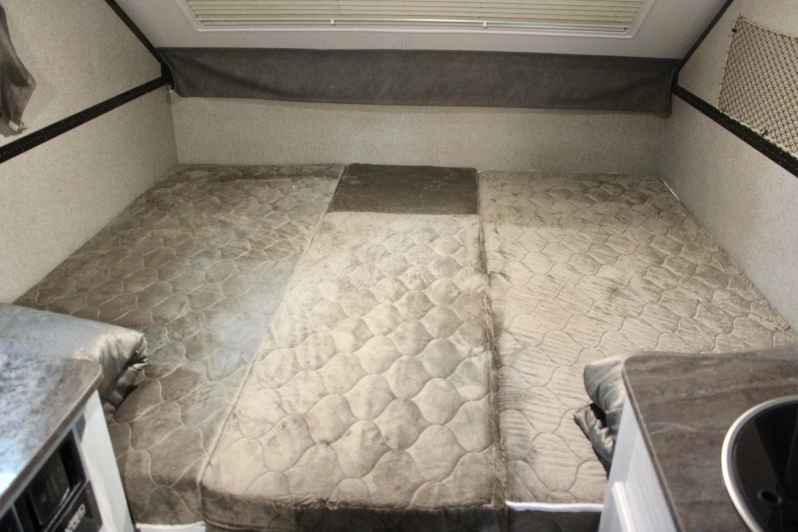 Sleeping area in the Flagstaff SE pop-up A-frame trailer