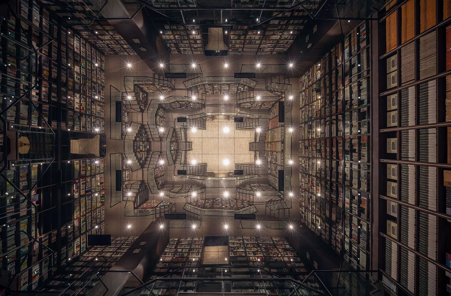 A reflective ceiling tops the huge main study inside the Chongqing Zhongshuge Bookstore