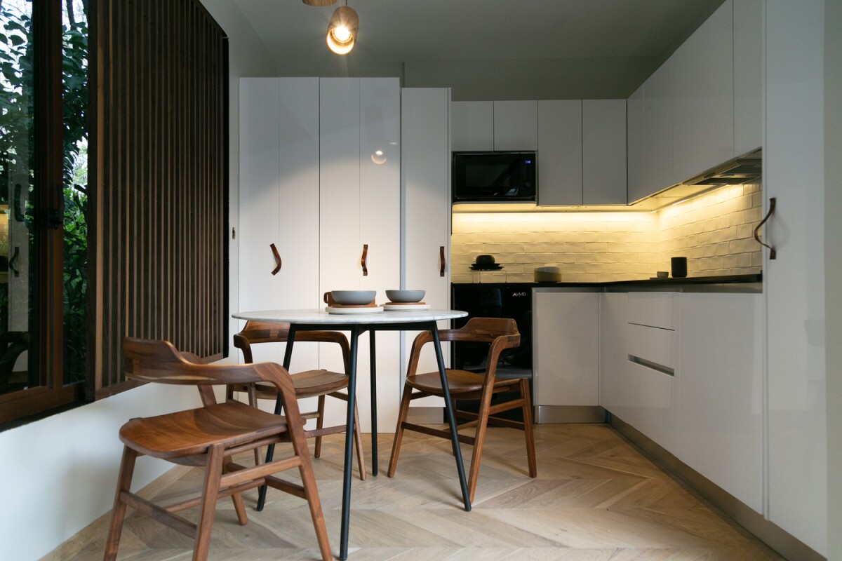 The VMD features a modern angular kitchen with meals area