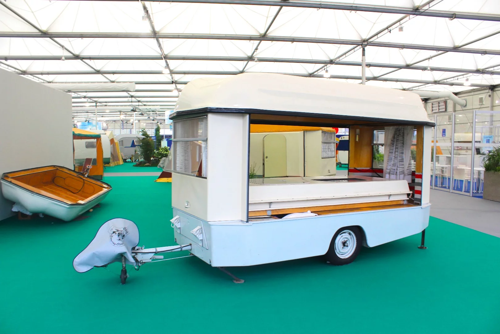 The 1962 Josef Hartmann FaWoBoo pop-up caravan includes an integrated boat in its design, providing outdoor recreation in multiple forms