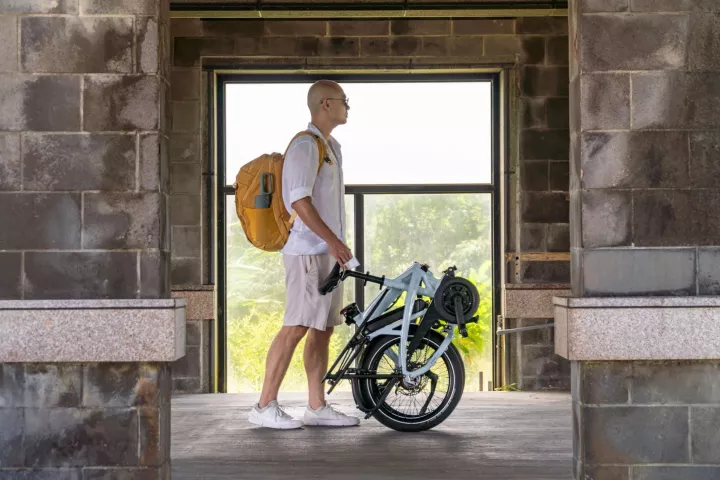 Riders can use the telescoping seat post to roll a folded Vektron ebike to the transport hub or into the office