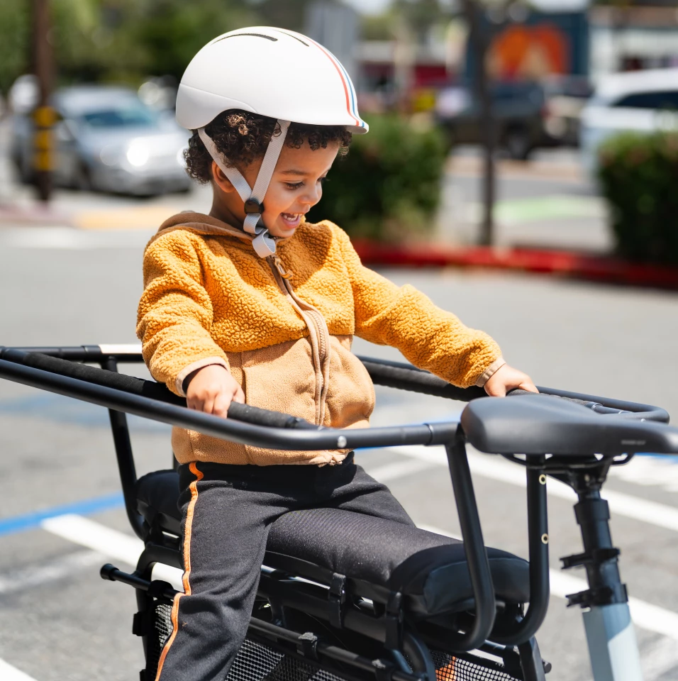 The Hooptie features handrails and leg guards for small passengers