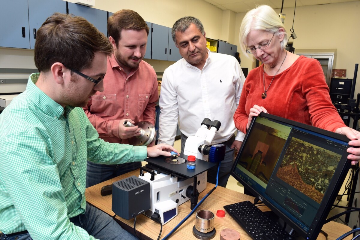 NASA's Marshall Space Flight Center team examining the printed metal cross sections