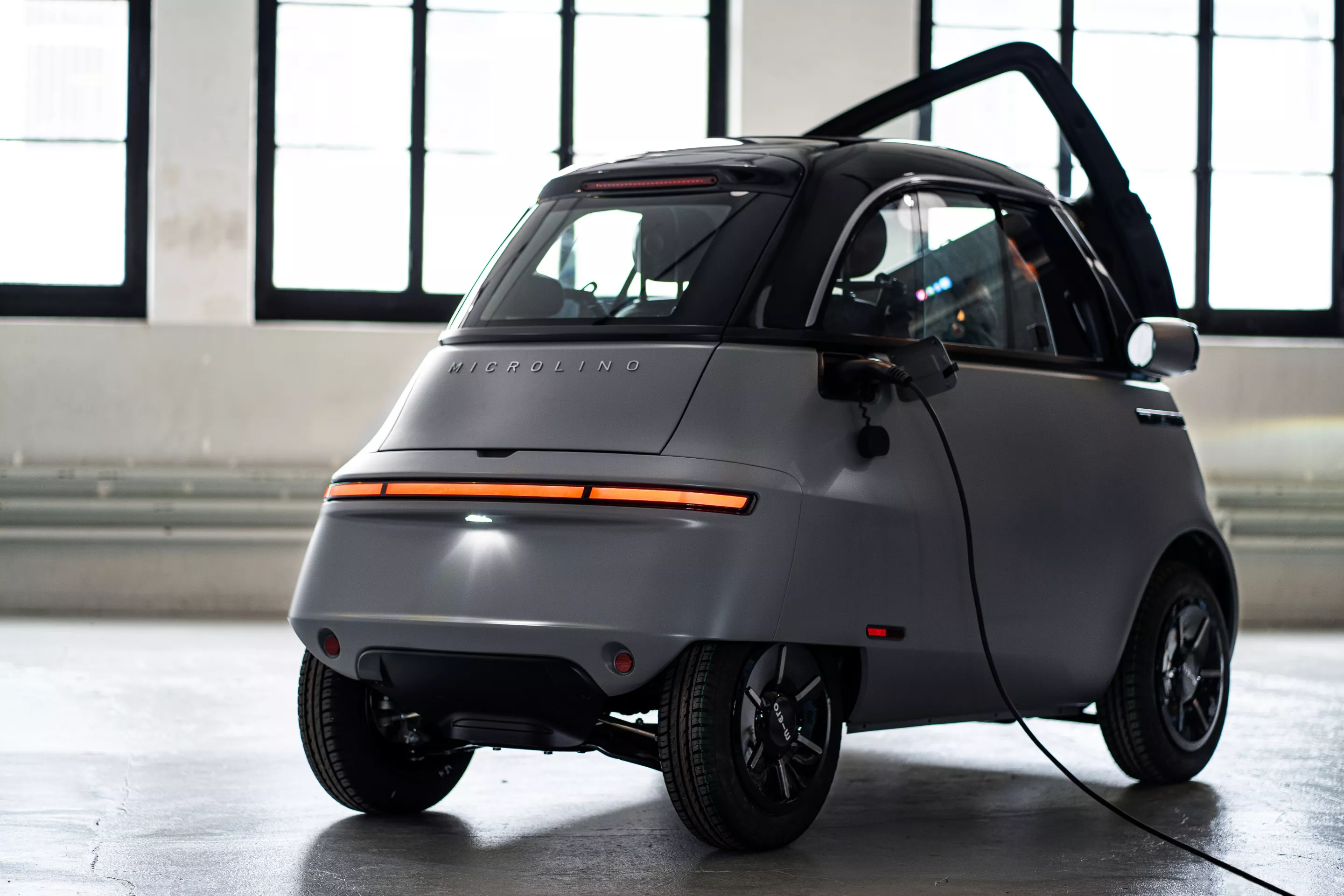 The Microlino 2.0 has a per-charge range of 125 km with a 8-kWh battery, or 200 km with a 14.4-kWh option