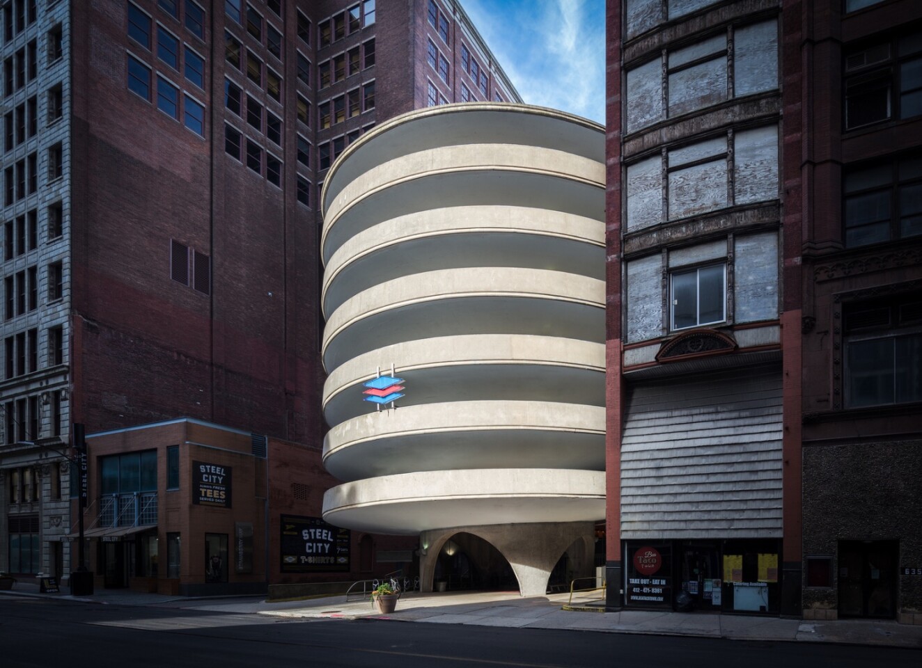Steel City, in Pittsburgh, PA, by Darren Bradley, is an AIA|LA APA Honor award recipient. "Architecture is so much about context, and this photograph truly captures that," says AIA's jury. "This photographer, by design or by chance, caught a shaft of light between buildings, illuminating a very surreal structure – or at least it appears surreal compared to its neighbors on the street front"