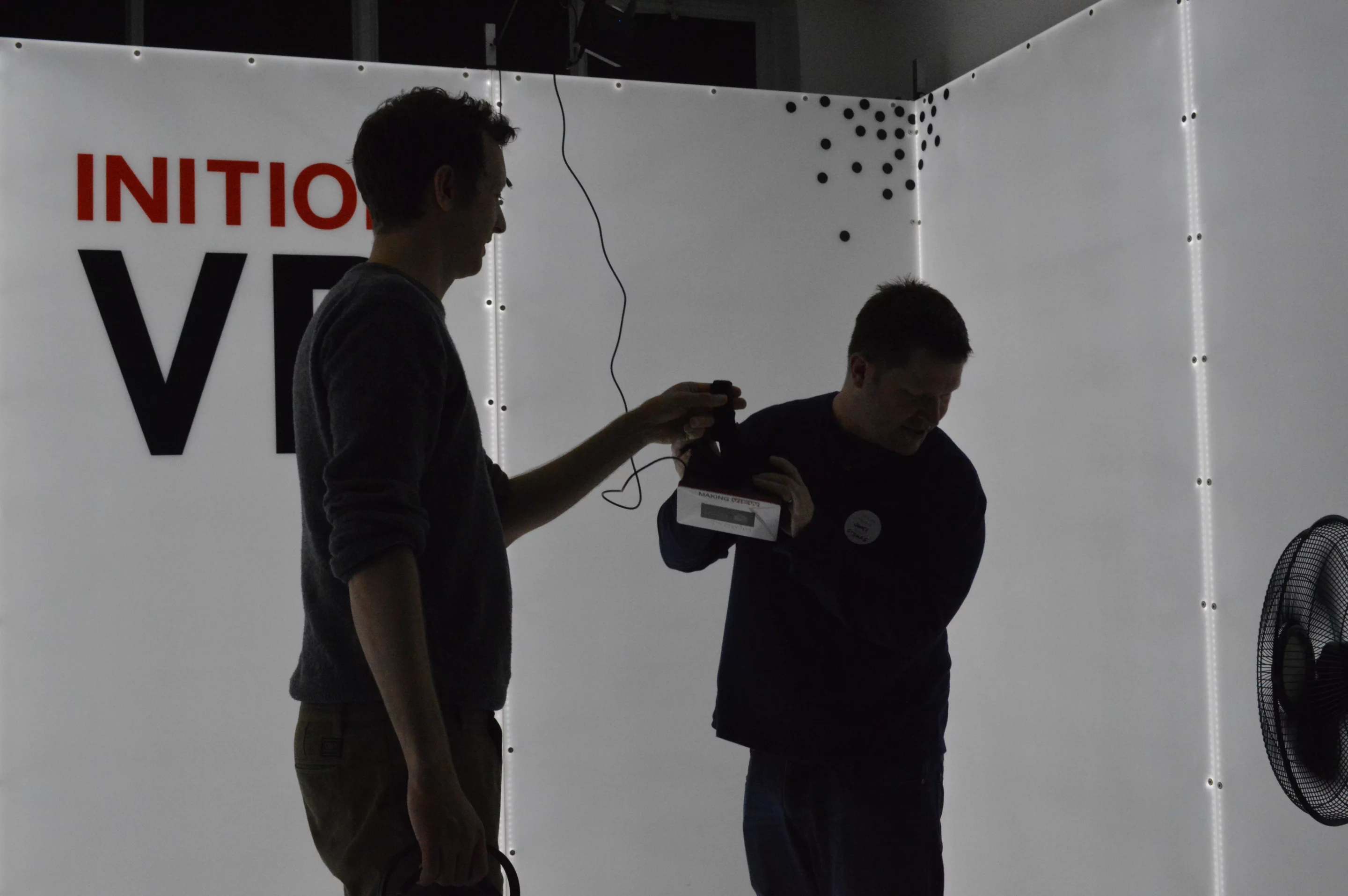 Inition's Andy Millns helps me on with the Oculus Rift (Photo: Gizmag)