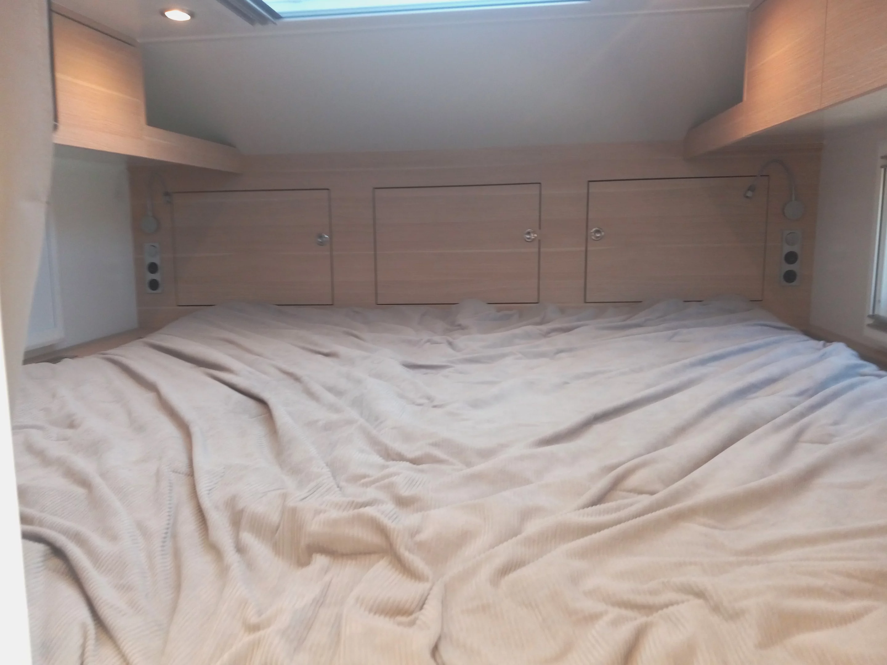 The alcove fits a proper king-size bed and still has room to surround it with HVAC vents