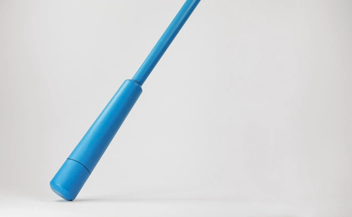 The top part of the handle is released via a spring mechanism and is connected to the interior canopy