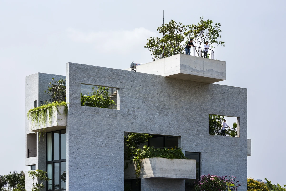 Binh House's greenery shades the home and its layout creates a stack effect, where air is drawn inside for improved ventilation