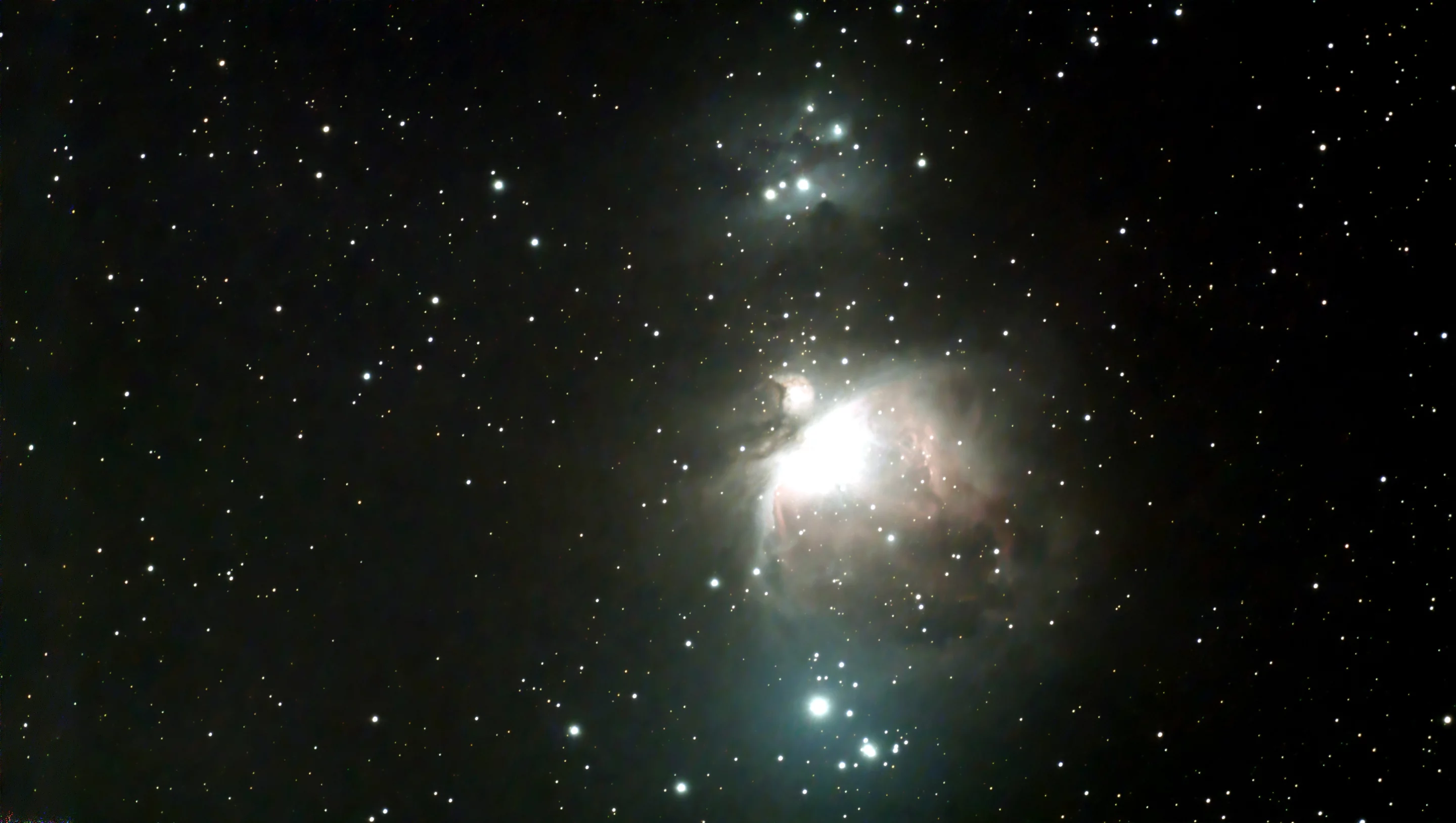 Stacked image of the Orion Nebula - shutter 60, gain 60, stack count 40 (image tweaked using GIMP)