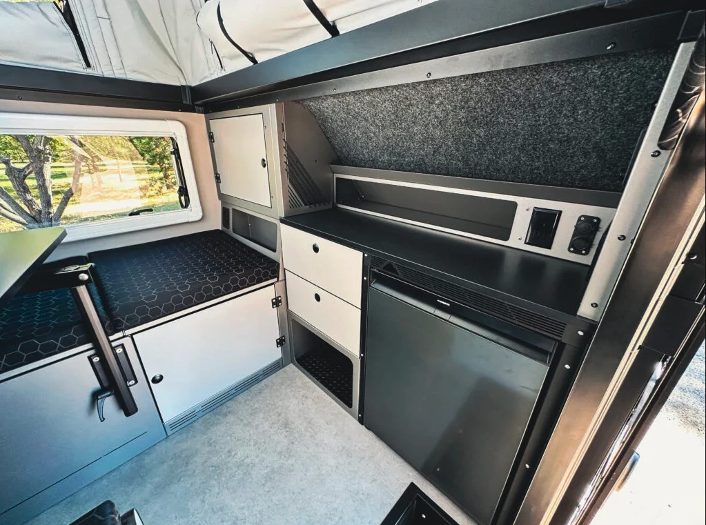The minibar is a nice C10 feature that provides interior access to the fridge and a generous shelf for making snacks, mixing cocktails or just using as a side table