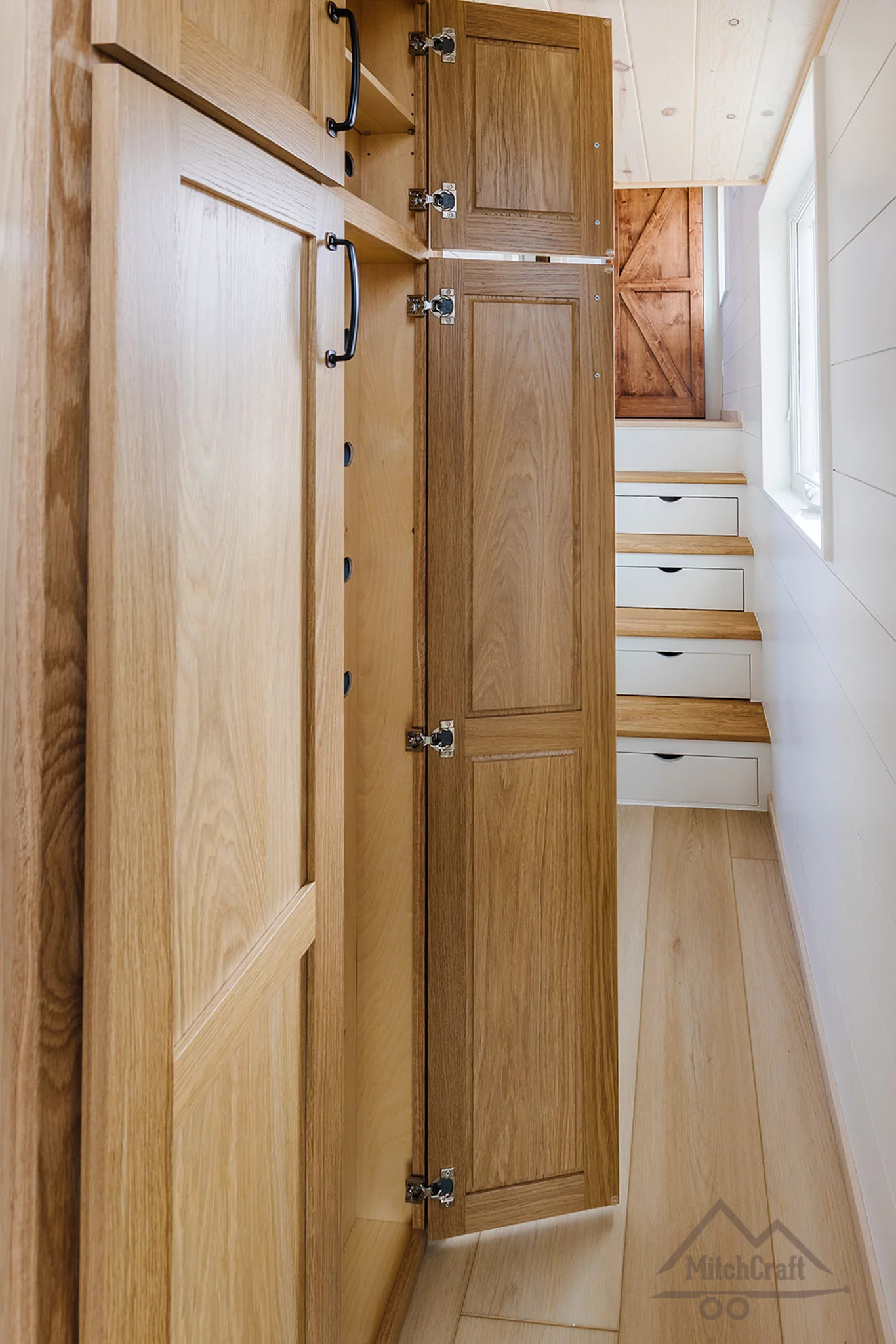 The CC 31' x 10' includes a hallway that offers access to the bathroom and bedroom and features storage space