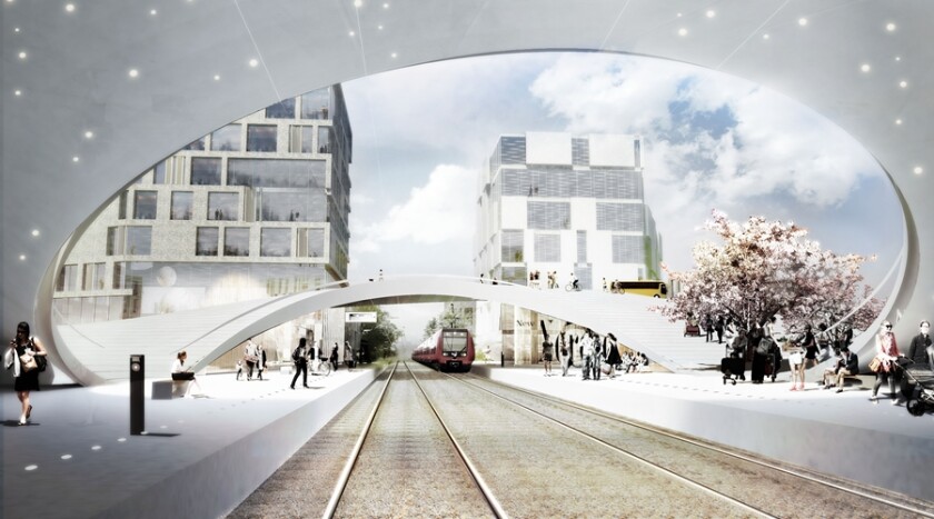 Vinge Train Station has an undulating ring that rises above the tracks and merges into the ground on either side