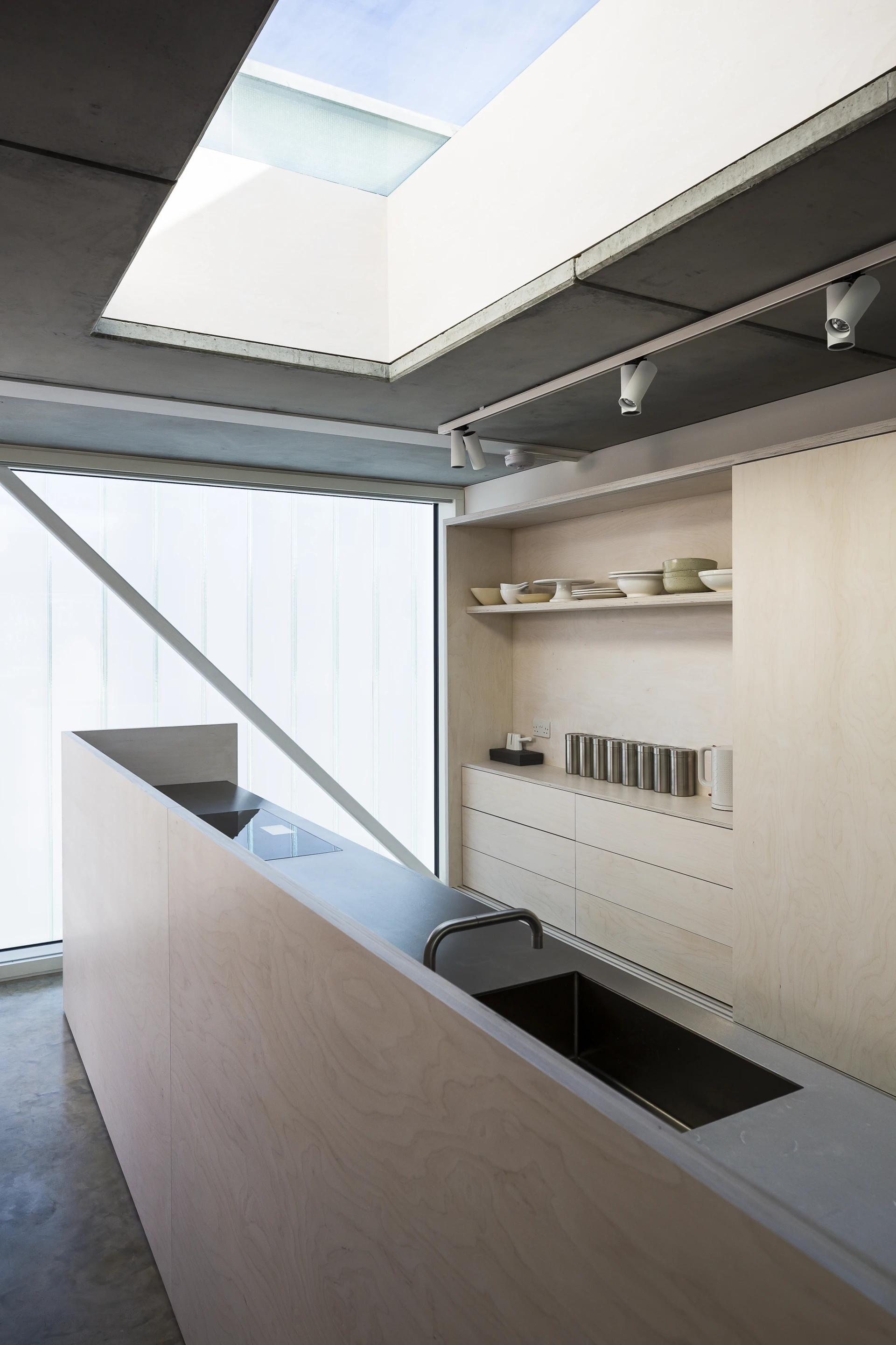 Slip House, by UK-based Carl Turner Architects, fits neatly between a row of terraced houses in Brixton, London