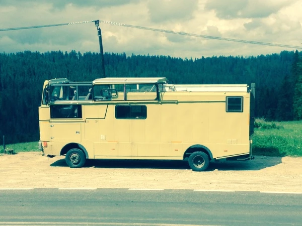 The sliding glass enclosure creates a motorhome convertible