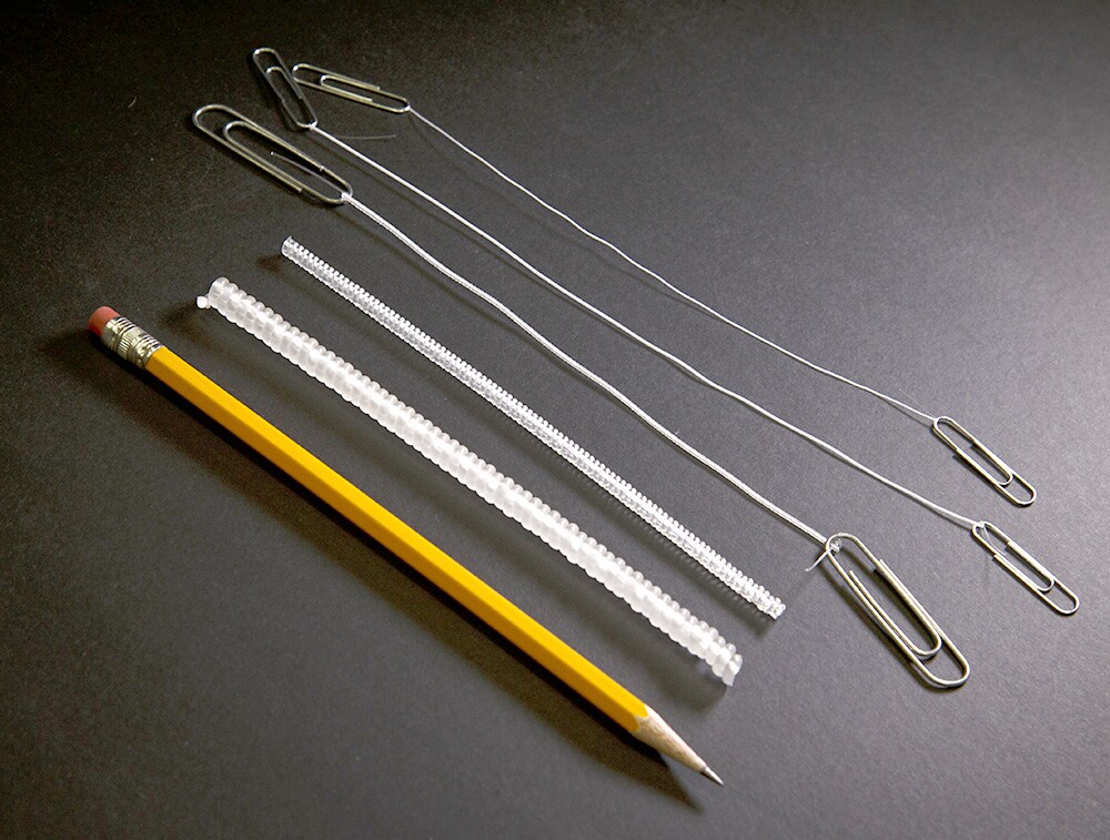 A variety of sizes of the artificial muscles, with a pencil for scale (Photo: University of Texas at Dallas)