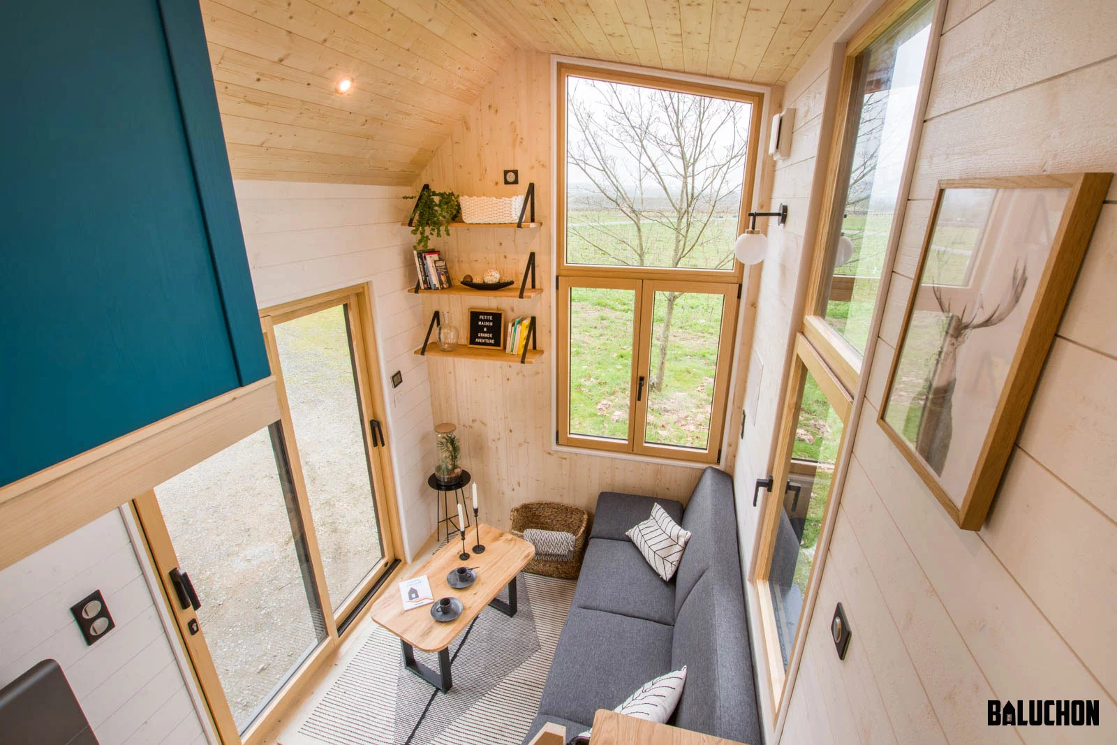 Visitors enter the Kejadenn into the living room, which looks light-filled and airy thanks to its generous glazing and high ceiling