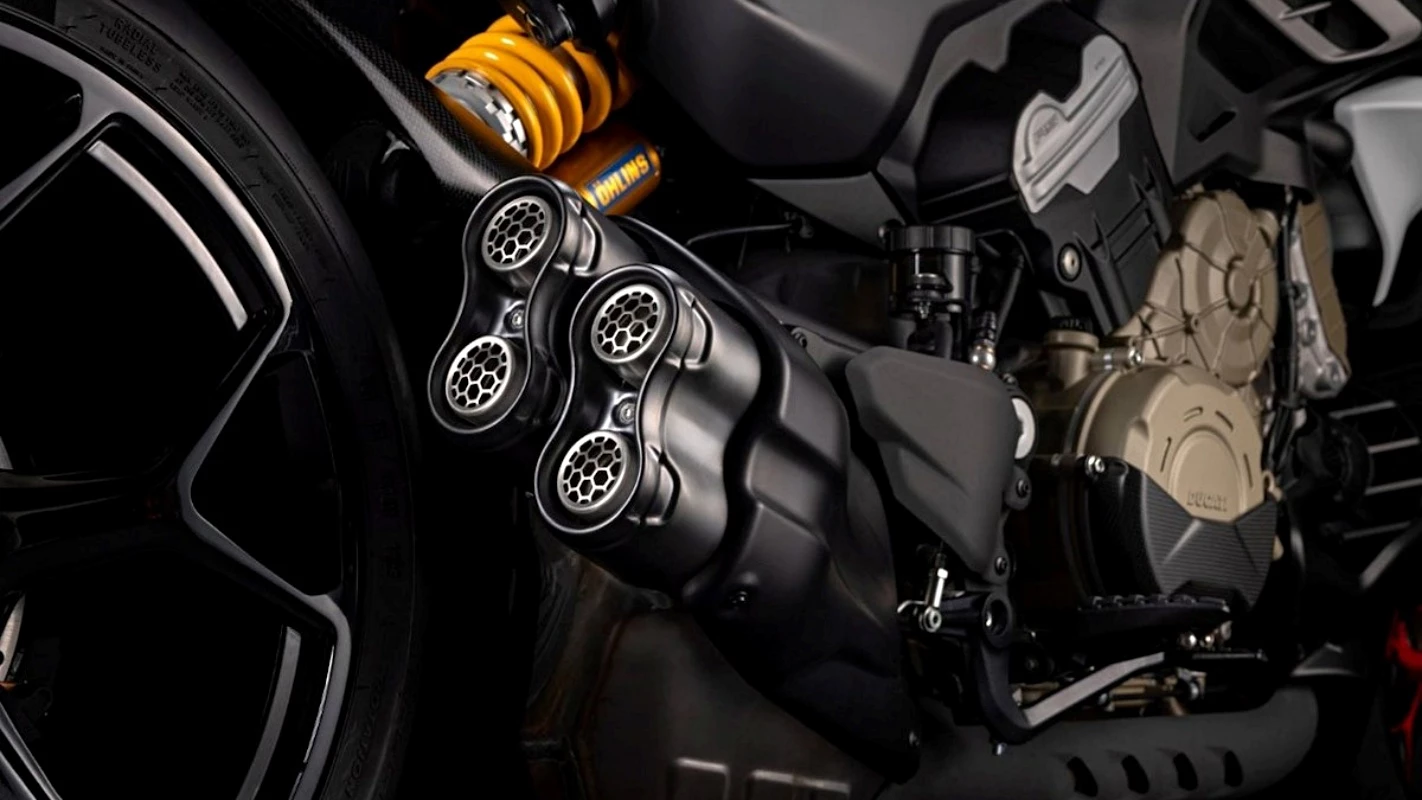 There's substantial use of titanium and carbon fiber components in places like the exhaust end cap, air intakes, seat tailpiece, mudguards, and tank covers