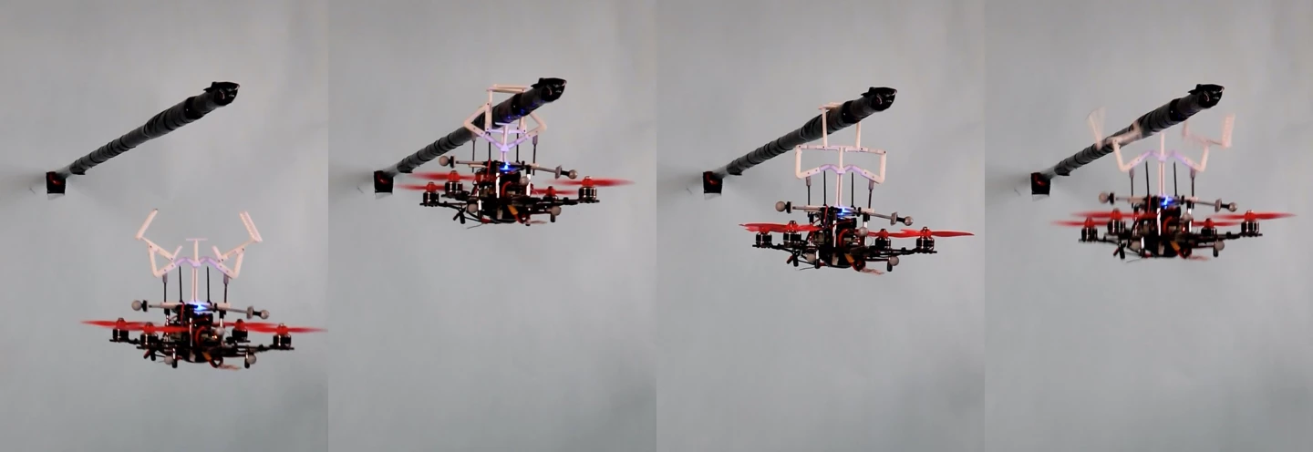 A quadcopter uses the MIP to hang from a horizontal rod